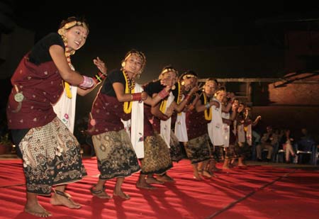 Nepalese ethnic cultural group from mid-western Nepal perform traditional dance 'Kaura Naach' during the International Folk Music Festival in Kathmandu, capital of Nepal, on Nov. 7, 2008. [Xinhua] 