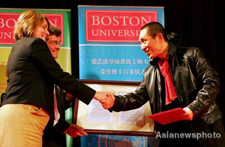 Acclaimed movie director Zhang Yimou accepts an invitation on Friday to receive an honorary doctorate from Boston University November 7, 2008. Laurie Phol (left), the university's vice-president of enrollment and student affairs, and Tom Fiedler, dean of its college of communication, made the invitation at the Beijing Film Academy, Zhang's alma mater. 