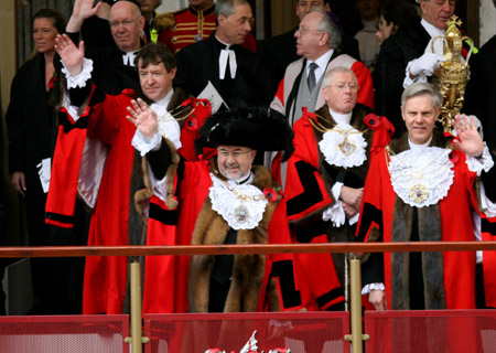 Ian Luder (L Front), newly-elected 681st Lord Mayor of the City of London, waves to the crowds during the 2008 Lord Mayor&apos;s Show in London Nov. 8, 2008. The annual street parade is one of the best known events in London dating back to 1215. 