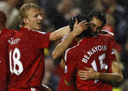 Liverpool&apos;s Alvaro Arbeloa (R) celebrates with Yossi Benayoun (2nd R) and Dirk Kuyt (L) after scoring during their English Premier League soccer match against West Bromwich Albion in Liverpool, northern England, November 8, 2008.