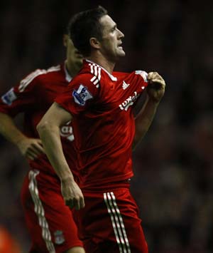 Liverpool&apos;s Robbie Keane celebrates after scoring during their English Premier League soccer match against West Bromwich Albion in Liverpool, northern England, November 8, 2008.