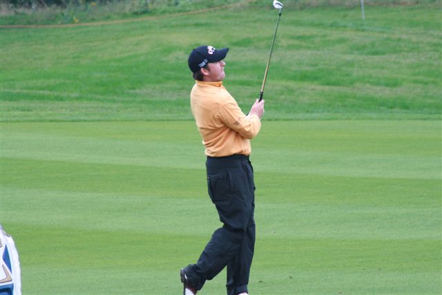 McDowell watches his iron find the green on 9.