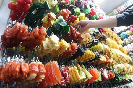 Photo taken on Nov. 8, 2008 shows food-shaped accessories at the Tianyi Market in Beijing, capital of China. Accessories made into the shape of food are popular among youngsters in Beijing. 