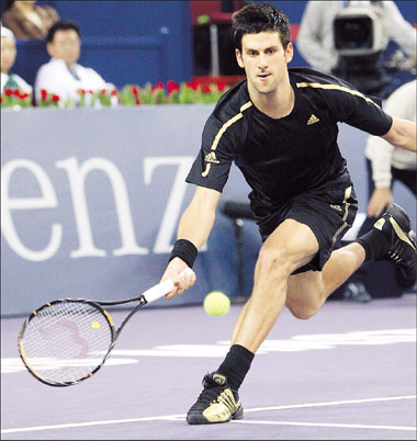 Novak Djokovic chases the ball during his group match against Juan Martin del Potro of Argentina at the 2008 Tennis Masters Cup in Shanghai yesterday. The Serb won the tournament opener 7-5, 6-3.