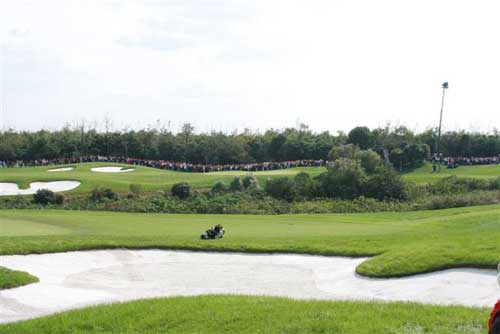 A huge gallery on 16 awaits the arrival of the Mickelson and Garcia groups. 