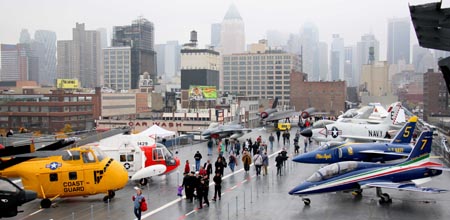 Visitors tour the newly renovated Intrepid Sea, Air and Space Museum at Pier 86 of Manhattan in New York, the United States, Nov. 8, 2008. The decommissioned USS aircraft carrier Intrepid reopened to the public after a two-year overhaul on Saturday. Opened in 1982, the Museum has received more than 10 million visitors.[Hou Jun/Xinhua]