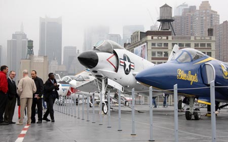 Visitors tour the newly renovated Intrepid Sea, Air and Space Museum at Pier 86 of Manhattan in New York, the United States, Nov. 8, 2008. The decommissioned USS aircraft carrier Intrepid reopened to the public after a two-year overhaul on Saturday. Opened in 1982, the Museum has received more than 10 million visitors.[Hou Jun/Xinhua]