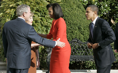 US President George W. Bush greets President-elect Barack Obama and his wife Michelle (C) as they arrive to the White House in Washington, November 10, 2008. [Agencies]
