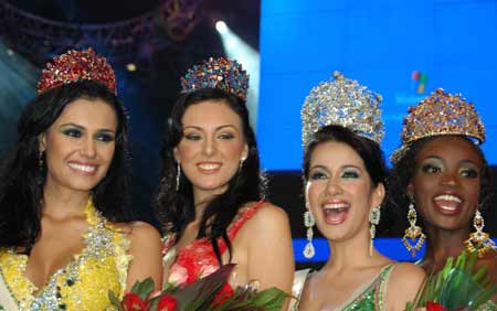 (from L to R) Miss Brazil Tatiane Kelen Alves, Miss Mexico Abigail Elizalde Romo, Miss Philippines Karla Henry, and Miss Tanzania Miriam Odemba, pose for a photo during the Miss Earth 2008 beauty pageant in Angeles City of Pampanga, north of Manila, Philippines, November 9, 2008. Eight-five beauties from all over the world attended the contest and Miss Philippines Karla Paula Henry won the title of Miss Earth.