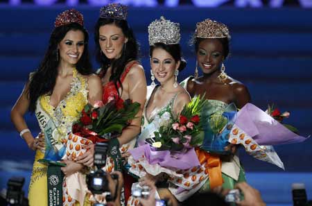 Miss Philippines Karla Henry (2nd R), 22, poses for photographers after winning the Miss Earth 2008 beauty pageant at the Expo amphitheatre in Clark air base in Pampanga, north of Manila November 9, 2008.