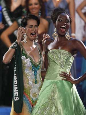 Miss Philippines Karla Henry (C), 22, reacts after winning the Miss Earth 2008 beauty pageant at the Expo amphitheatre in Clark air base in Pampanga, north of Manila November 9, 2008. 