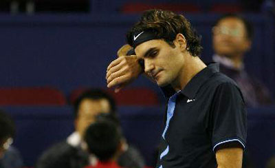 Federer down but not out