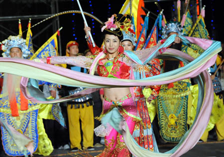 Artists perform traditional drama during a parade in Guilin, southwest China's Guangxi Zhuang Autonomous Region, Nov. 9, 2008. The parade was part of local celebrations for the 50th anniversary of the establishment of the Guangxi Zhuang Autonomous Region. [Photo: Xinhua/Chen Ruihua] 