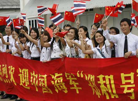 Local Chinese wave as they welcome Chinese navy ship (CNS) Zhenghe upon its arrival at the Bangkok Port, Thailand, Nov. 10, 2008.