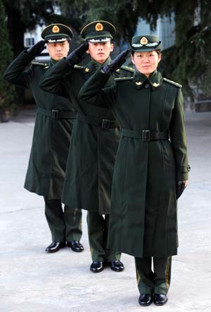 Two border patrol policemen and a policewoman in 07 Type winter uniforms are seen in this picture, Qingdao, East China's Shandong, November 10, 2008. Type 07 is a new family of military uniforms used by all branches of the People's Liberation Army (PLA) and People's Armed Police (PAP) of the People's Republic of China. 