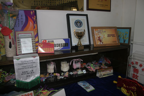 This photo, taken on Monday, November 10th, 2008, shows the handicrafts made by the trainees of a training centre for people with intellectual disabilities and the prizes awarded to the centre at the Fengyuan Street residential area in Guangzhou. 