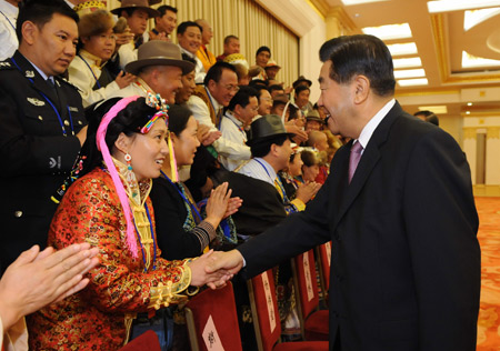 Jia Qinglin (R), chairman of the National Committee of the Chinese People's Political Consultative Conference(CPPCC), meets with members of a delegation of China's ethnic minorities in Beijing, capital of China, Nov. 11, 2008.