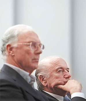 FIFA President Sepp Blatter (right) sits beside former German national soccer captain and Bayern Munich President Franz Beckenbauer as they attend the International Football Arena (IFA) meeting in Zurich on Monday. [Reuters] 