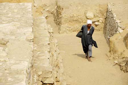 A Worker removes stones and dusts off the new found pyramid in Saqqara, 30Km south of Cairo, capital of Egypt, on Nov. 11, 2008. 