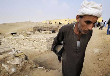 A Worker removes stones and dusts off the new found pyramid in Saqqara, 30Km south of Cairo, capital of Egypt, on Nov. 11, 2008. 