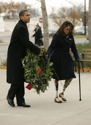U.S. President-elect Barack Obama and double-amputee Iraq war veteran Tammy Duckworth place a wreath at a veterans memorial in Chicago Nov. 11, 2008. 