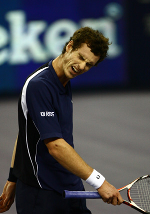 Andy Murray of Great Britain reacts after losing a point to Gilles Simon of France during the men's singles competition at Tennis Masters Cup Shanghai, 2008, in Shanghai, east China, Nov. 12, 2008.[Xinhua] 