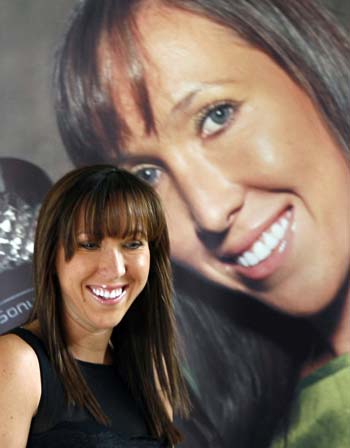 Serbian tennis player Jelena Jankovic smiles as she arrives at a news conference in Belgrade November 11, 2008. Jankovic is World Number One in the WTA ranking. [Agencies]
