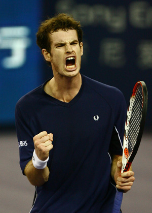 Andy Murray of Great Britain jubilates after scoring against Gilles Simon of France during the men's singles competition against at Tennis Masters Cup Shanghai, 2008, in Shanghai, east China, Nov. 12, 2008. 