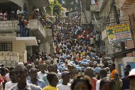 Residents arrive at the morgue of the main hospital in Port-au-Prince, to identify the bodies of their relatives who were killed when a school collapsed, November 12, 2008. 