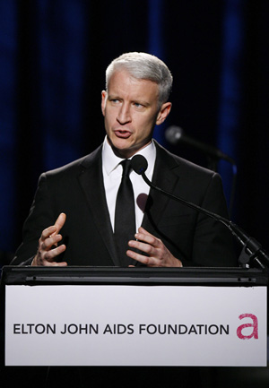 Television personality Anderson Cooper addresses the crowd during a benefit for the Elton John AIDS foundation in New York November 11, 2008. 