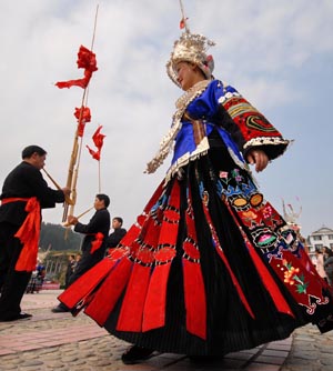 A girl wearing traditional costume competes in the folk dance contest held in Leishan County, southwest China's Guizhou Province, Nov. 11, 2008. The folk dance contest of Miao ethnic group kicked off in Leishan County on Tuesday, attracting over 200 villagers of seven teams. [Xinhua/Qiao Qiming]