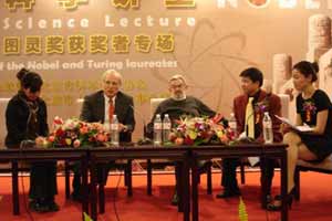 Martinus Veltman (3rd right), winner of the Nobel Prize in physics, and Butler W. Lampson (2nd left), who received the Turing Award in 1992, speak to the Beijing public at the Forbidden City Concert Hall on November 12, 2008. [Wang Wei/China.org.cn]