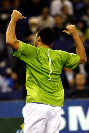 French player Jo-Wilfried Tsonga jubilates after winning over Serbia's Novak Djokovic during the men's singles competition at Tennis Masters Cup Shanghai, 2008, in Shanghai, east China, Nov. 13, 2008. [Xinhua]