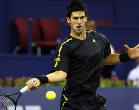 Serbia's Novak Djokovic plays a forehand against French player Jo-Wilfried Tsonga during the men's singles competition at Tennis Masters Cup Shanghai, 2008, in Shanghai, east China, Nov. 13, 2008. [Xinhua]