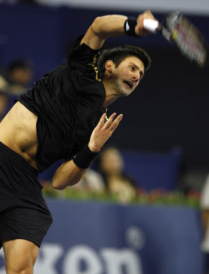 Serbia's Novak Djokovic serves against French player Jo-Wilfried Tsonga during the men's singles competition at Tennis Masters Cup Shanghai, 2008, in Shanghai, east China, Nov. 13, 2008. [Xinhua]
