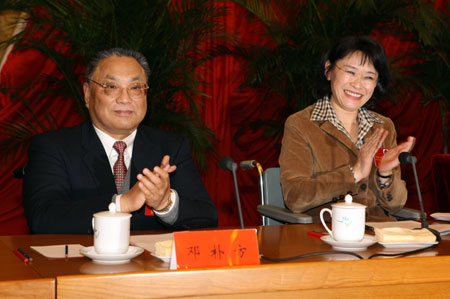 New chairperson of the China Disabled Persons' Federation (CDPF) Zhang Haidi (R) and her predecessor Deng Pufang attend the closing ceremony of the fifth national congress of the China Disabled Persons' Federation (CDPF) in Beijing, capital of China, Nov. 13, 2008. 