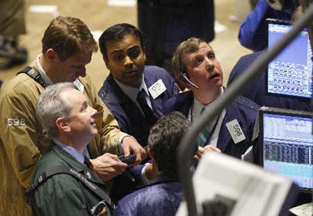 Traders work on the floor of the New York Stock Exchange, November 13, 2008. U.S. stocks surged on Thursday after hitting 5-1/2-year lows in a roller-coaster session as investors shrugged off dismal economic news to snap up beaten down shares and oil prices rose sharply after falling below $55 a barrel.