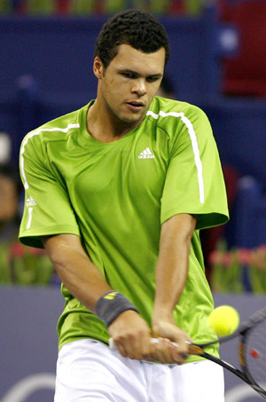French player Jo-Wilfried Tsonga returns the ball against Serbia's Novak Djokovic during the men's singles competition at Tennis Masters Cup Shanghai, 2008, in Shanghai, east China, Nov. 13, 2008. 
