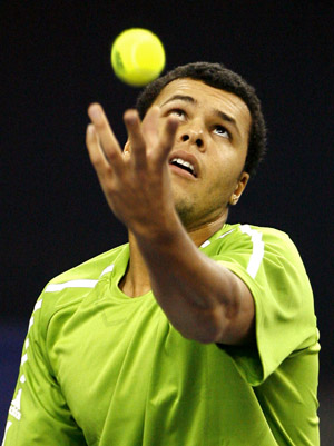 French player Jo-Wilfried Tsonga serves against Serbia's Novak Djokovic during the men's singles competition at Tennis Masters Cup Shanghai, 2008, in Shanghai, east China, Nov. 13, 2008. 