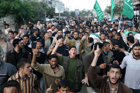 Palestinians take part in the funeral of four Hamas fighters in southern Gaza Strip town of Khan Younis, Nov. 13, 2008. The four were killed in an Israeli operation in the east of Khan Younis a day earlier. 