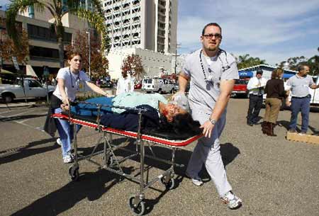 Simulated earthquake victims arrive at an outdoor triage center during an earthquake drill at the University California San Diego Medial Center in San Diego, California November 13, 2008. 