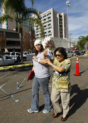 A simulated victim arrives at an outdoor triage center during an earthquake drill at the University California San Diego Medial Center in San Diego, California November 13, 2008. 