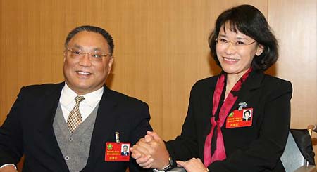 Zhang Haidi (R) and her predecessor Deng Pufang attend the closing session of the fifth national congress of the China Disabled Persons' Federation (CDPF) in Beijing, November 13, 2008. Zhang was elected as new chairperson of the CDPF and former chairperson Deng Pufang would serve as an honorary chairman. Writer and translator Zhang has long been regarded as a national role model for her tenacity. 