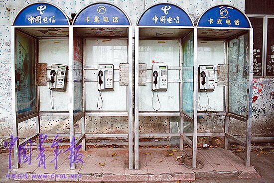 The phone booths near the closed toy factories are deserted in Dongguan, Guangdong Province.