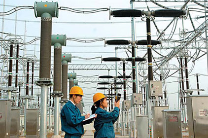 Technicians check power transmission lines in Shanxi province. 