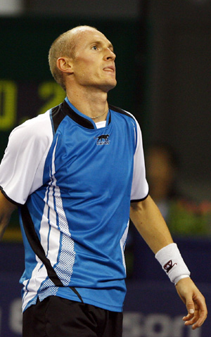 Russia's Nikolay Davydenko reacts during the men's singles competition against Argentina's Juan Martin Del Potro at Tennis Masters Cup Shanghai, 2008, in Shanghai, east China, Nov. 13, 2008. 