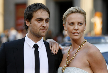 Cast member Charlize Theron and actor Stuart Townsend attend the movie premiere of 