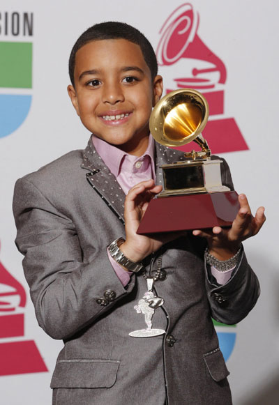 Miguelito holds the award he won for Best Latin Children's Album above his head at the 9th annual Latin Grammy Awards in Houston, Texas November 13, 2008. 