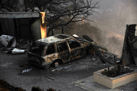 The burnt remains of a car and home are seen in Santa Barbara, California November 14, 2008.