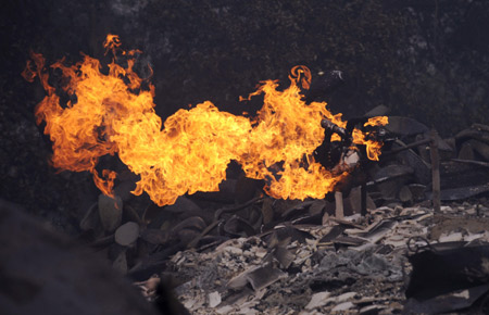 A gas meter continues to burn in the Montecito area of Santa Barbara County, California Nov. 14, 2008.